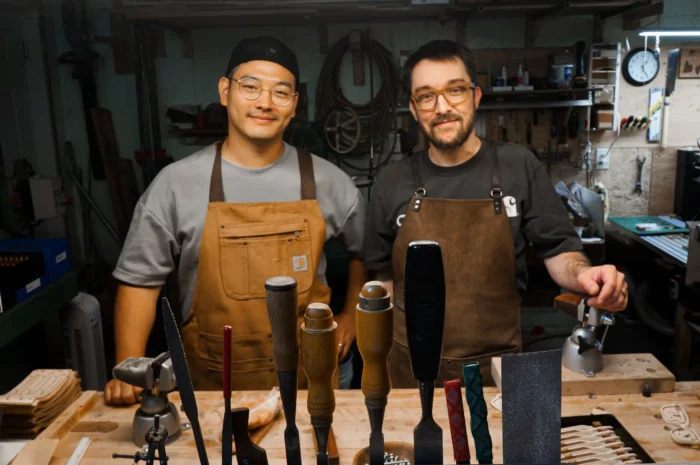 Junghoon and David behind the workbench.